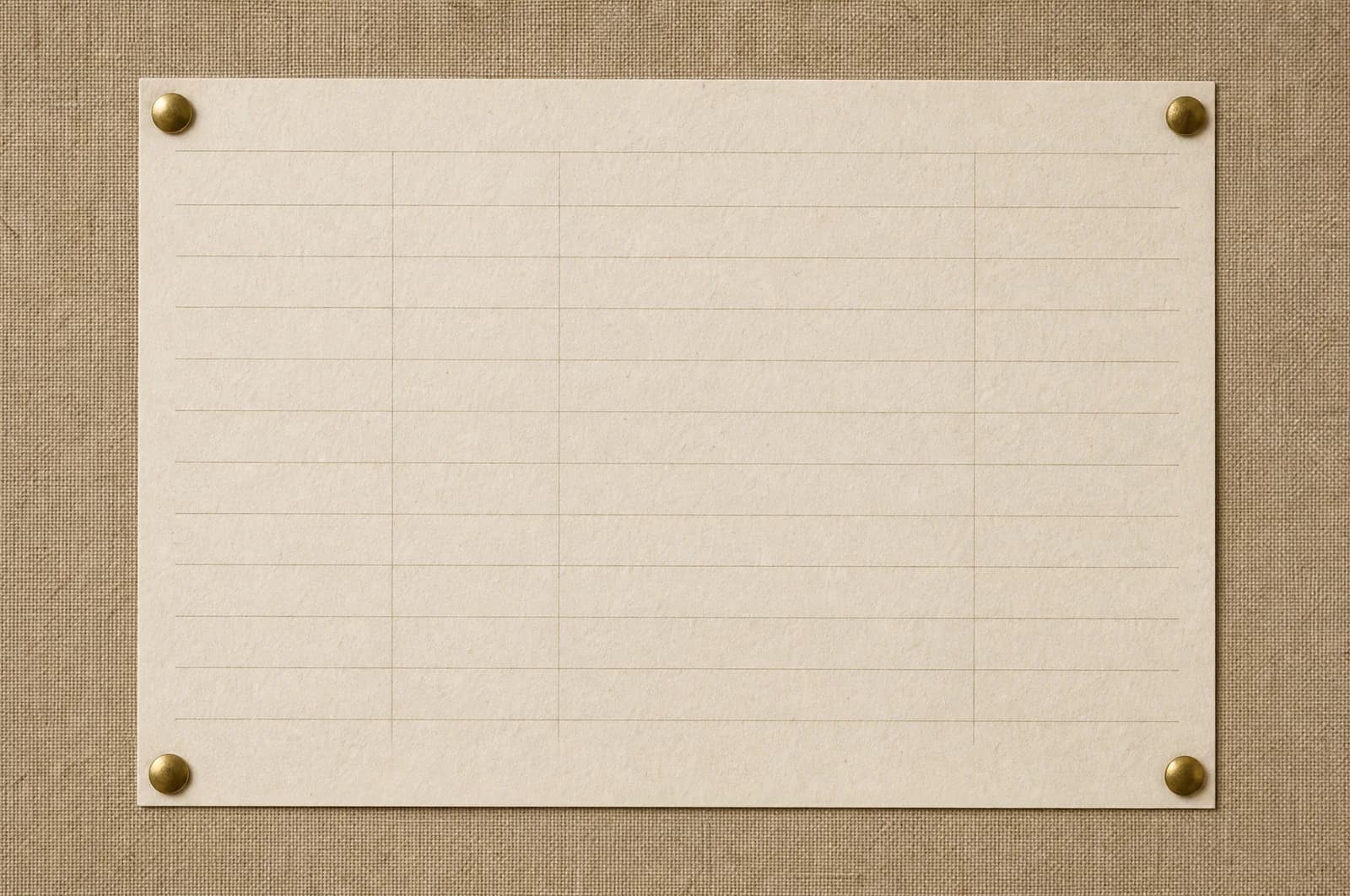 A blank ruled sheet pinned at four corners to a linen board